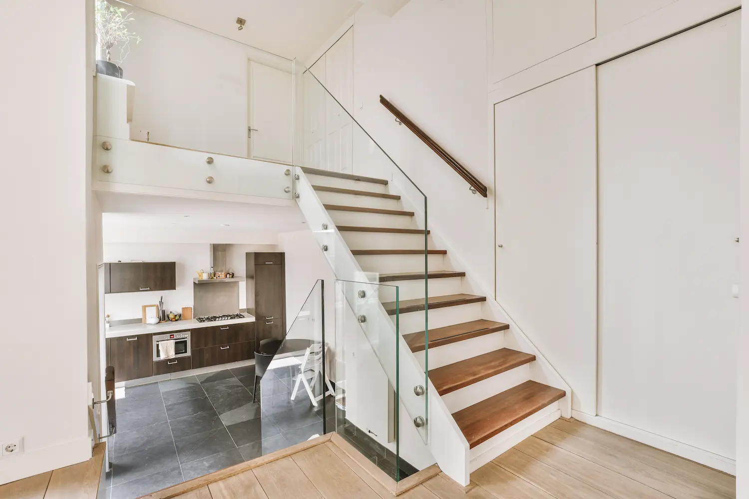 wooden-staircase-in-spacious-hall-of-apartment-2025-02-09-22-37-49-utc